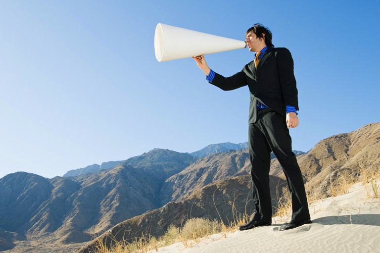 Buy YouTube subscribers - man using megaphone